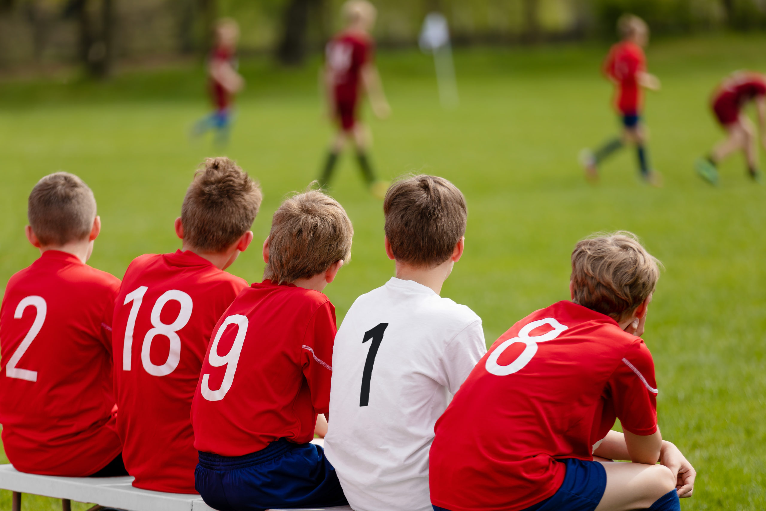 Kids Football Team. Children Football Academy. Substitute Soccer Players Sitting on Bench. Young ...